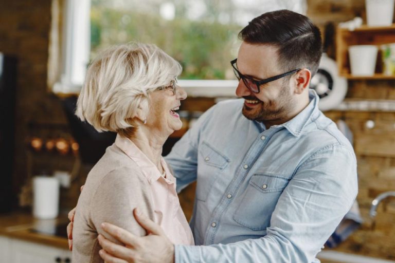 eqc-homecare-agency Old lady laughing while having a pleasant conversation with Home care guy