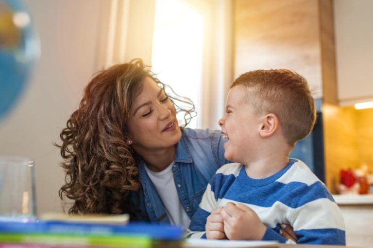 eqc-therapy-with-parent-training A young woman making a young boy laugh