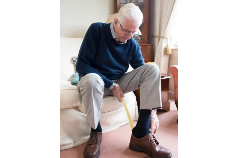 EQC OT Can Benefit Seniors Old man wearing his shoes by himself