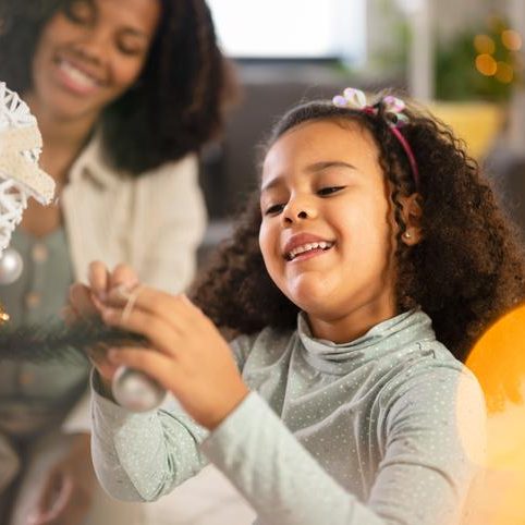 A very happy kid is celebration for joyful Christmas tree for holidays