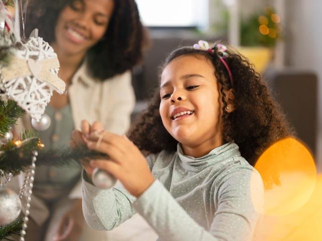 A very happy kid is celebration for joyful Christmas tree for holidays