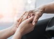 and old person's hand in a young hands