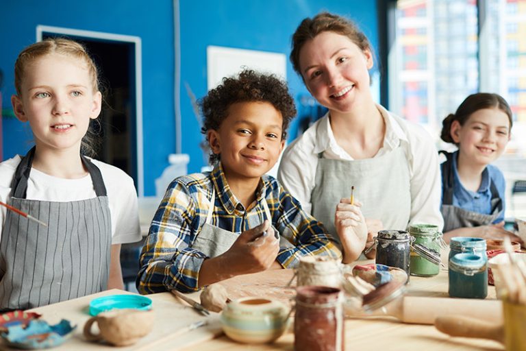 Benefits of ABA Therapy Kids doing painting with teacher