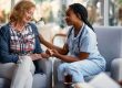 Nurse taking care of the aged woman
