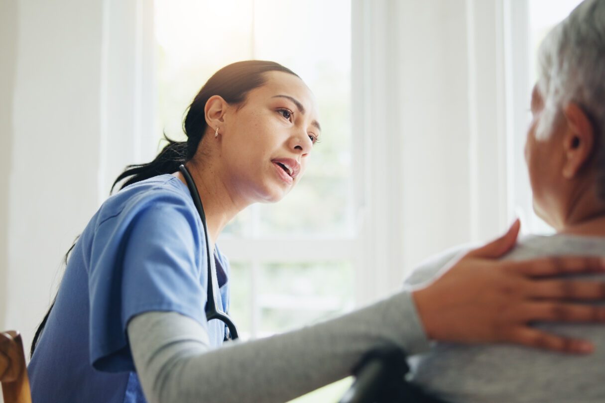 Home Care Agency Over a Private Caregiver – june blog Caregiver lady talking to the old lady