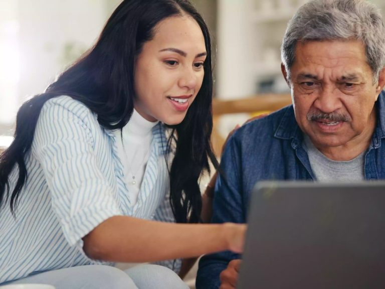 caregiver lady helping an old man