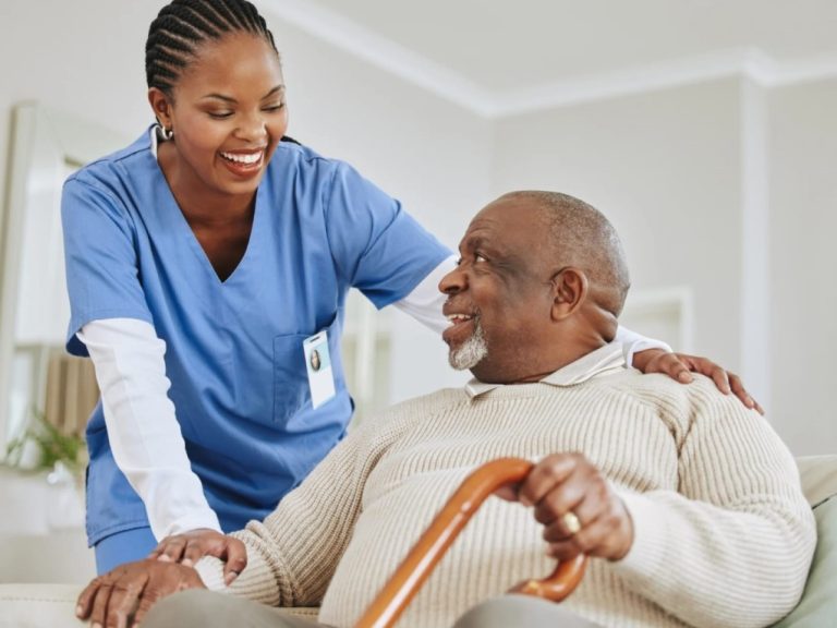 Private duty nurse having a laugh with an old man